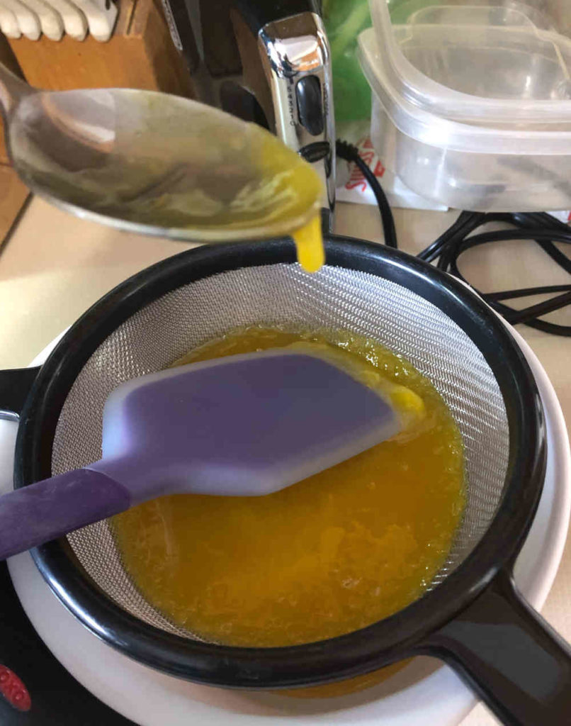 Straining the lemon curd