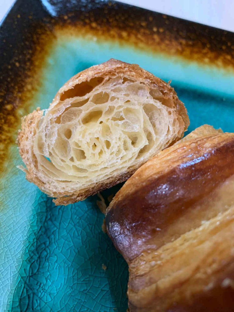 shows the cut end of a croissant